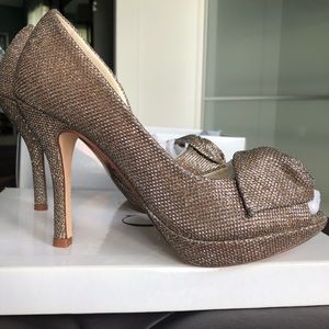 Metallic platform peep toe pumps by Caparros